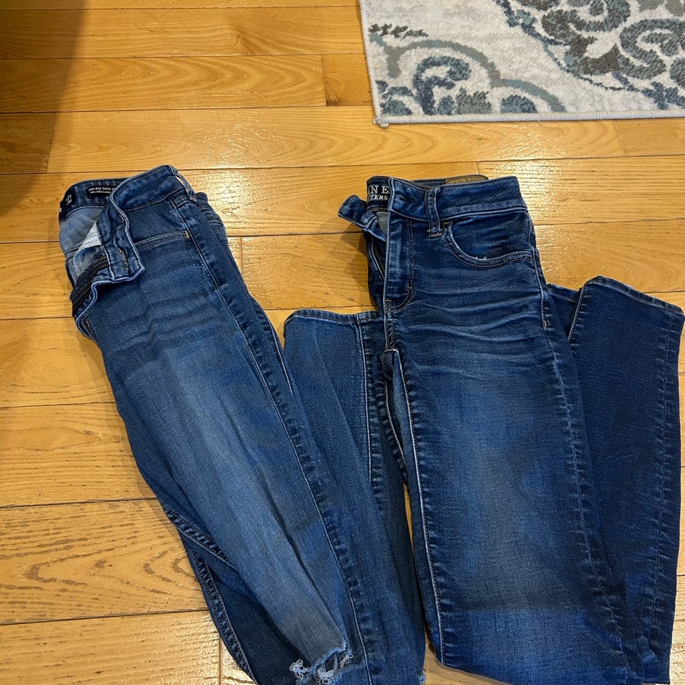 One Hollister and One American Eagle Dark Blue Jeans